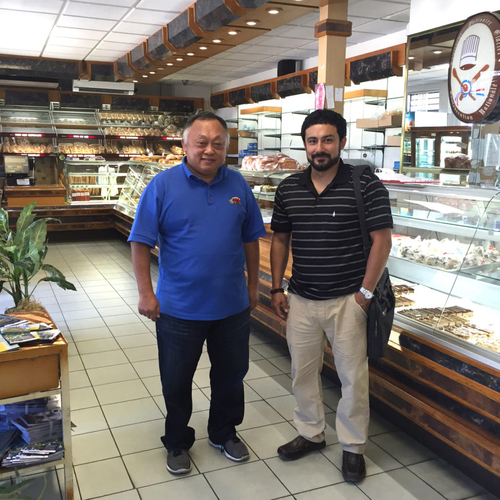 Mr Tam, Head of the Bakers' Association in New Caledonia, takes Philip on a tour at the Perfecta bakery.