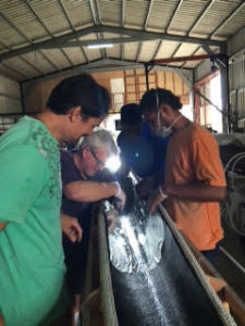 The Waimana Va'a team with John Hayes, renowned master maritime builder.